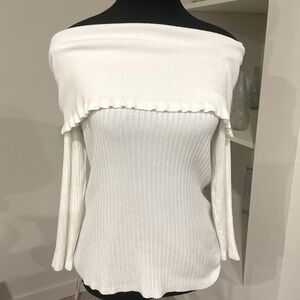 Cute white off the shoulder Sweater with Ruffled neckline.